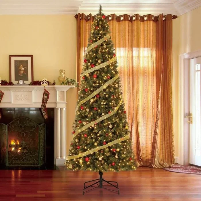 Home Heritage 12-ft Pine Pre-Lit Traditional Slim Artificial Christmas Tree with 1100 Constant Warm White LED Lights