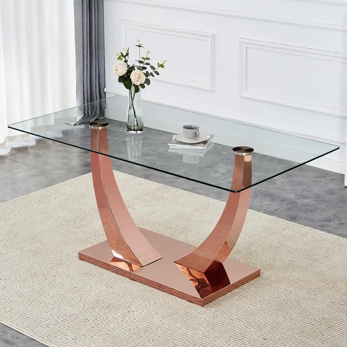 Modern minimalist rectangular glass dining table, 0.4 “thick, tempered glass tabletop, rose gold colored legs. Used in kitchen, dining room, and living room 63” x 31.5 “x 29.5” F-1548